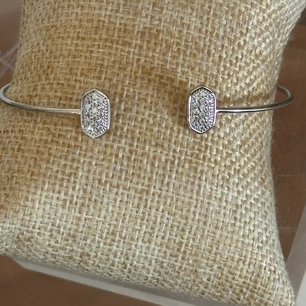 Lovely pavé rhinestone open bangle bracelet set in silver tone
NEVER WORN